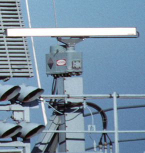 Marine radar slotted array antenna mounted on motor which spins it.
